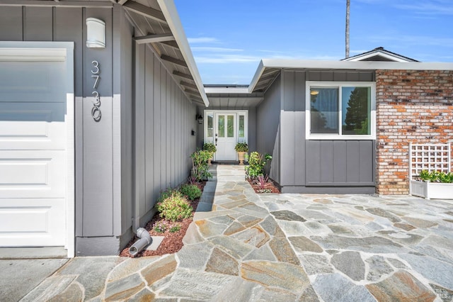 3730 Ruston Ln, Napa, CA 94558 - property entrance with board and batten siding and a garage
