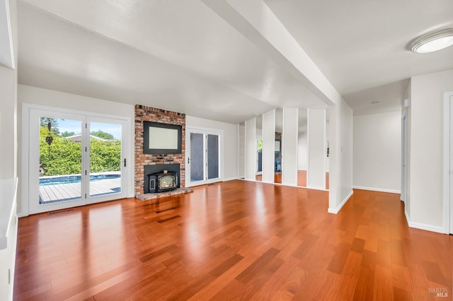 3730 Ruston Ln, Napa, CA 94558 - unfurnished living room with wood finished floors, baseboards, and a wood stove