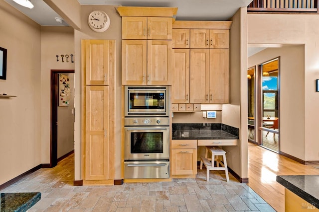 303 Mctavish Ct Unit A, Fairfield, CA 94534 - kitchen with appliances with stainless steel finishes, a warming drawer, light brown cabinetry, and stone tile floors