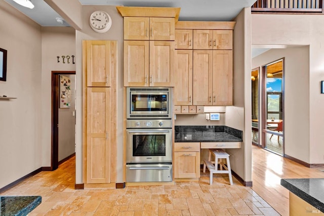303 Mctavish Ct Unit A, Fairfield, CA 94534 - kitchen featuring appliances with stainless steel finishes, a warming drawer, light brown cabinetry, and baseboards
