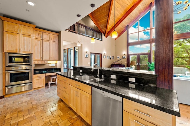 303 Mctavish Ct Unit A, Fairfield, CA 94534 - kitchen featuring stainless steel appliances, a warming drawer, light brown cabinetry, a wood ceiling with exposed beams, and high vaulted ceiling