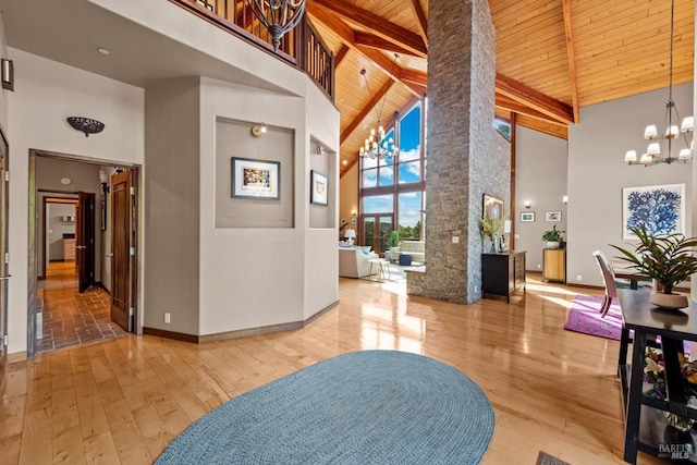 303 Mctavish Ct Unit A, Fairfield, CA 94534 - entrance foyer featuring a chandelier, high vaulted ceiling, wooden ceiling with exposed beams, ornate columns, and hardwood / wood-style flooring