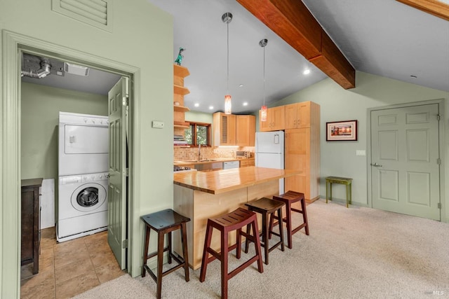 303 Mctavish Ct Unit A, Fairfield, CA 94534 - kitchen with stacked washer / drying machine, butcher block countertops, white appliances, a kitchen breakfast bar, and decorative backsplash