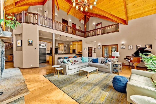 303 Mctavish Ct Unit A, Fairfield, CA 94534 - living room featuring a wood ceiling with exposed beams, a chandelier, light wood-style floors, and high vaulted ceiling