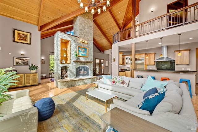 303 Mctavish Ct Unit A, Fairfield, CA 94534 - living area with wooden ceiling with exposed beams, high vaulted ceiling, a chandelier, a stone fireplace, and wood finished floors