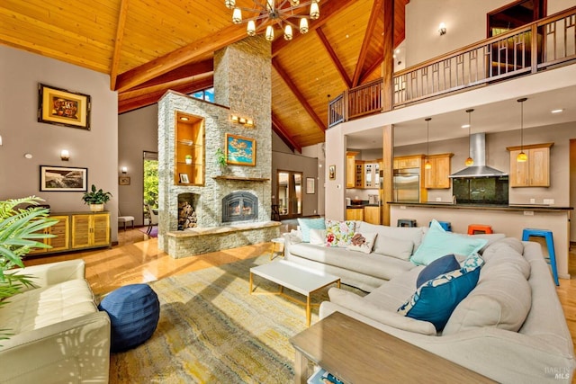 303 Mctavish Ct Unit A, Fairfield, CA 94534 - living area with a wooden ceiling with exposed beams, wood finished floors, high vaulted ceiling, a chandelier, and a stone fireplace