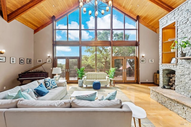 303 Mctavish Ct Unit A, Fairfield, CA 94534 - living room featuring french doors, high vaulted ceiling, wood finished floors, wooden ceiling with exposed beams, and a chandelier