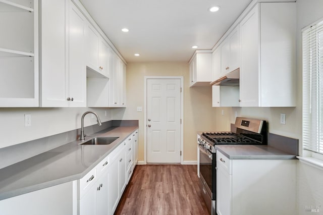 1313 Mcneil Ave, Petaluma, CA 94954 - kitchen featuring stainless steel gas range, a sink, under cabinet range hood, white cabinetry, and recessed lighting