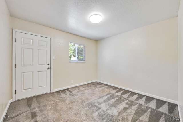 1313 Mcneil Ave, Petaluma, CA 94954 - spare room featuring carpet flooring, baseboards, and a textured ceiling