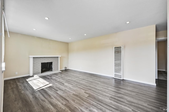 1313 Mcneil Ave, Petaluma, CA 94954 - unfurnished living room featuring a heating unit, dark wood-style floors, baseboards, recessed lighting, and a fireplace