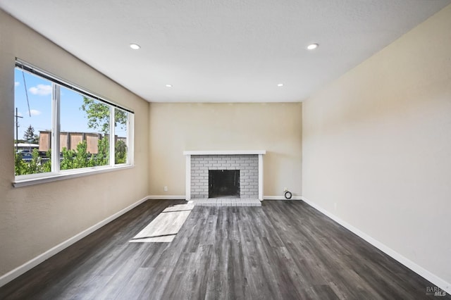 1313 Mcneil Ave, Petaluma, CA 94954 - unfurnished living room featuring wood finished floors, baseboards, a fireplace, and recessed lighting