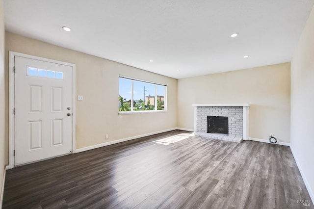 1313 Mcneil Ave, Petaluma, CA 94954 - unfurnished living room with baseboards, dark wood finished floors, recessed lighting, and a fireplace