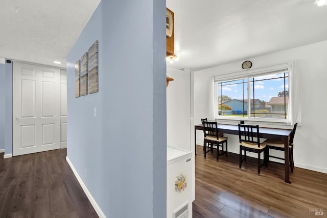 130 Ward Ct, Vallejo, CA 94589 - corridor featuring dark wood-style flooring and baseboards