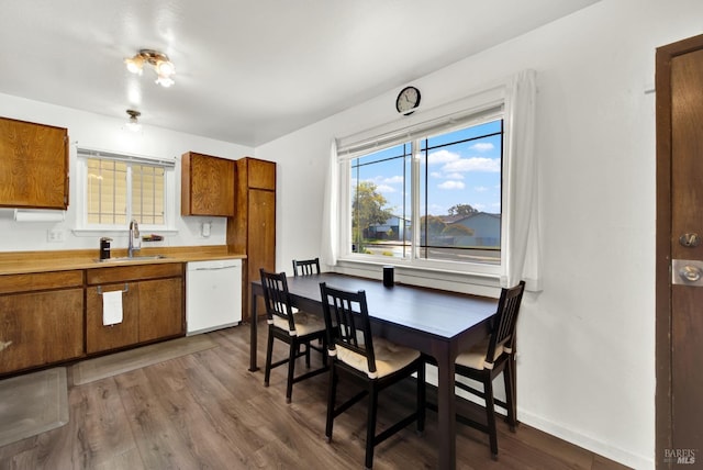 130 Ward Ct, Vallejo, CA 94589 - kitchen with dishwasher, a sink, brown cabinetry, dark wood-style flooring, and light countertops
