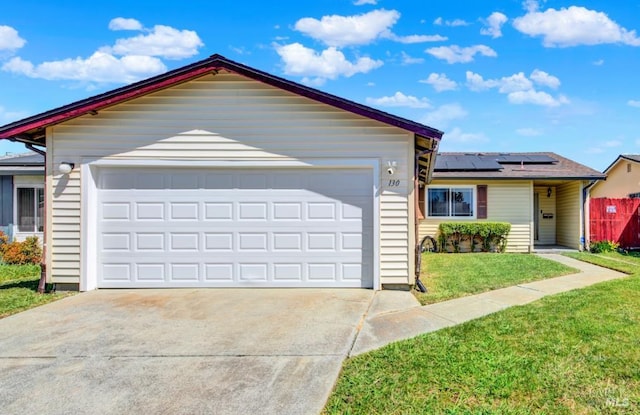 130 Ward Ct, Vallejo, CA 94589 - ranch-style house featuring roof mounted solar panels, a garage, a front yard, and driveway