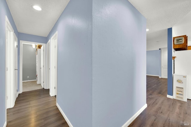 130 Ward Ct, Vallejo, CA 94589 - hallway featuring wood finished floors, baseboards, recessed lighting, and a textured ceiling