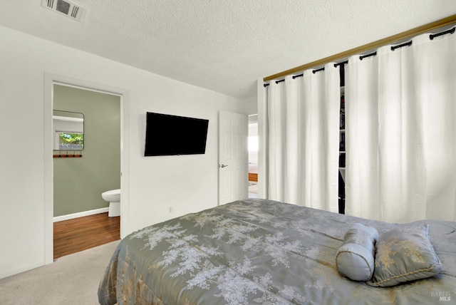 130 Ward Ct, Vallejo, CA 94589 - bedroom featuring carpet flooring, a textured ceiling, baseboards, and ensuite bathroom