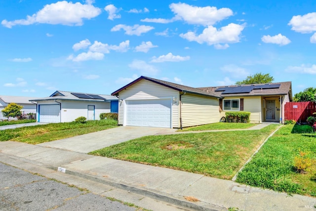 130 Ward Ct, Vallejo, CA 94589 - ranch-style house featuring roof mounted solar panels, an attached garage, and driveway