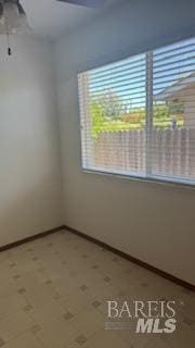 3232 Macleod St, Napa, CA 94558 - unfurnished room with ceiling fan, tile patterned floors, and baseboards