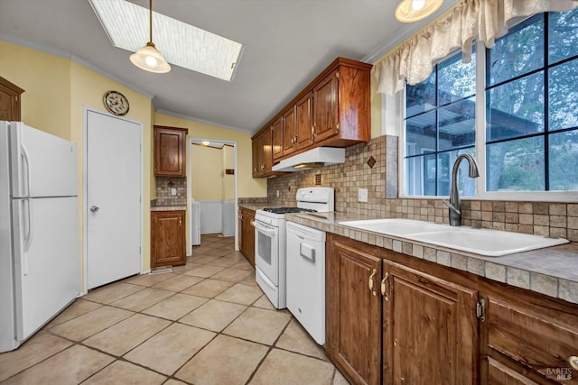 4538 Hill Rd, Lakeport, CA 95453 - kitchen featuring white appliances, a sink, under cabinet range hood, ornamental molding, and decorative backsplash