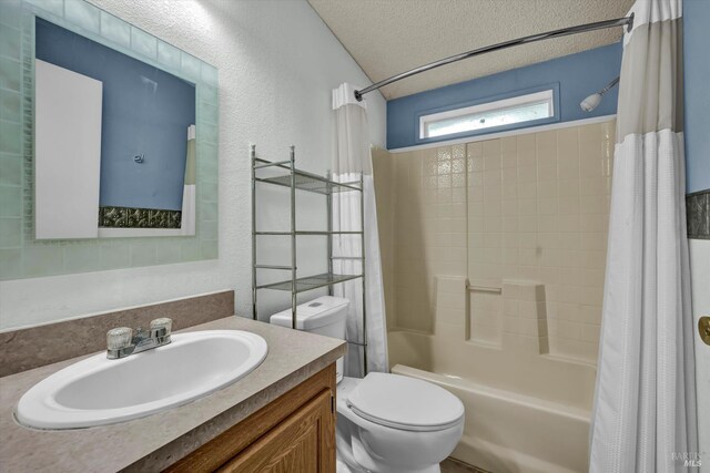 4538 Hill Rd, Lakeport, CA 95453 - bathroom with toilet, shower / tub combo, vanity, a textured wall, and a textured ceiling