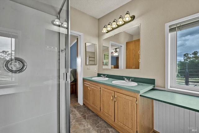 4538 Hill Rd, Lakeport, CA 95453 - bathroom featuring marble finish floors, double vanity, a ceiling fan, and connected bathroom