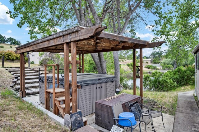 4538 Hill Rd, Lakeport, CA 95453 - view of patio / terrace featuring a hot tub and a water view
