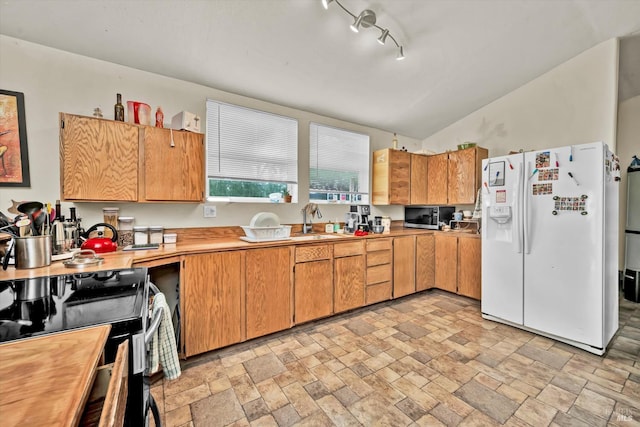 4538 Hill Rd, Lakeport, CA 95453 - kitchen featuring white refrigerator with ice dispenser, stainless steel microwave, range with electric cooktop, light countertops, and a sink