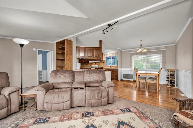 4538 Hill Rd, Lakeport, CA 95453 - living area featuring crown molding, light wood finished floors, vaulted ceiling, and heating unit