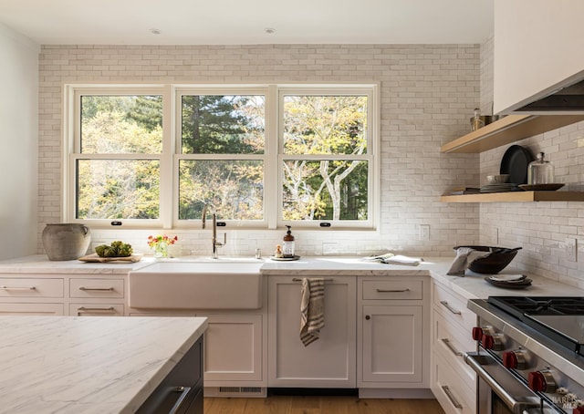5 Monte Vista Ave, Larkspur, CA 94939 - kitchen featuring a sink, decorative backsplash, light stone countertops, white cabinets, and stainless steel stove