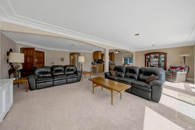 7753 N Cora Dr, Lucerne, CA 95458 - living area featuring light carpet, arched walkways, ornamental molding, and ceiling fan