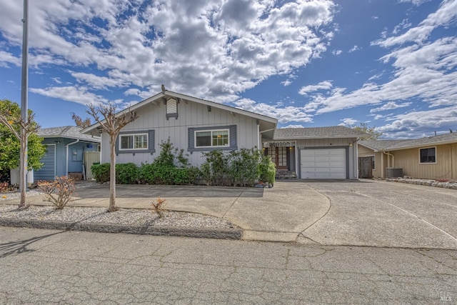 7753 N Cora Dr, Lucerne, CA 95458 - ranch-style house with an attached garage, central AC unit, and driveway