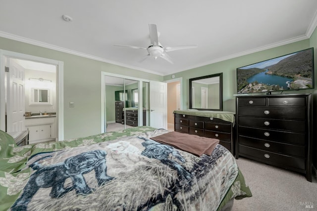 7753 N Cora Dr, Lucerne, CA 95458 - carpeted bedroom featuring crown molding, a closet, ensuite bath, a sink, and a ceiling fan