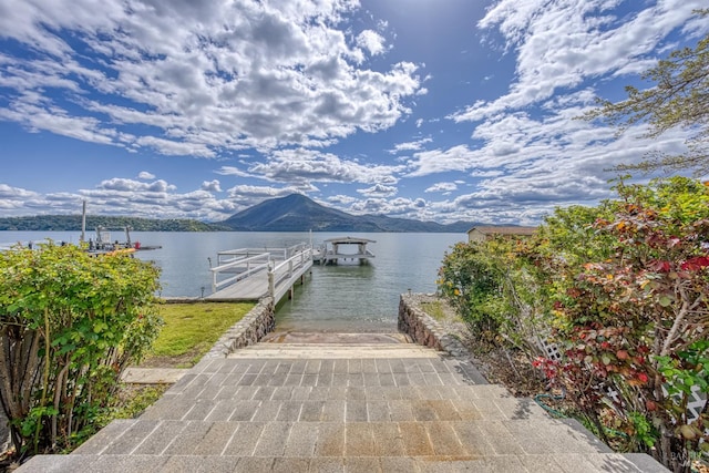 7753 N Cora Dr, Lucerne, CA 95458 - dock area featuring a boat ramp and a water and mountain view