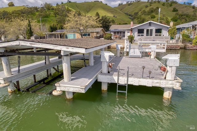 7753 N Cora Dr, Lucerne, CA 95458 - dock area featuring boat lift and a water view
