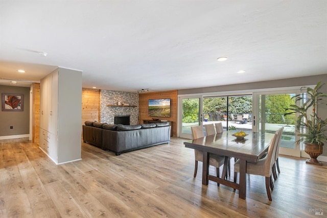 10505 Cherry Ridge Rd, Sebastopol, CA 95472 - dining area featuring light wood finished floors, recessed lighting, baseboards, and a stone fireplace