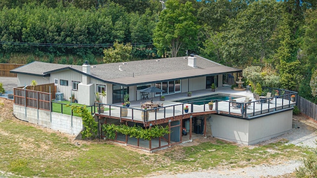 10505 Cherry Ridge Rd, Sebastopol, CA 95472 - rear view of property featuring a chimney, a wooden deck, central AC unit, and a shingled roof