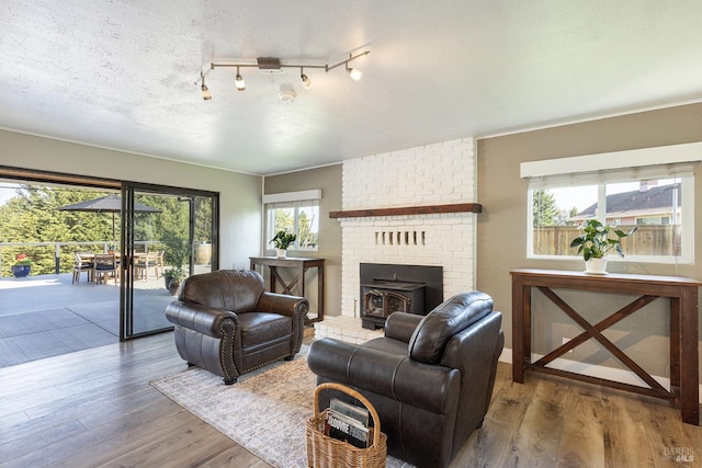 10505 Cherry Ridge Rd, Sebastopol, CA 95472 - living area with wood finished floors and a wood stove