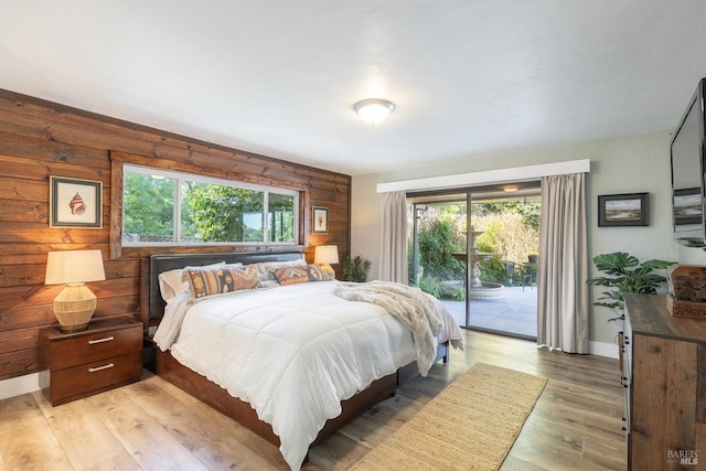 10505 Cherry Ridge Rd, Sebastopol, CA 95472 - bedroom featuring access to exterior, multiple windows, light wood-type flooring, and baseboards