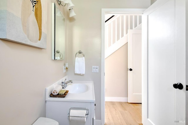 41 Salinas Ave, San Anselmo, CA 94960 - half bathroom featuring wood finished floors, vanity, and toilet