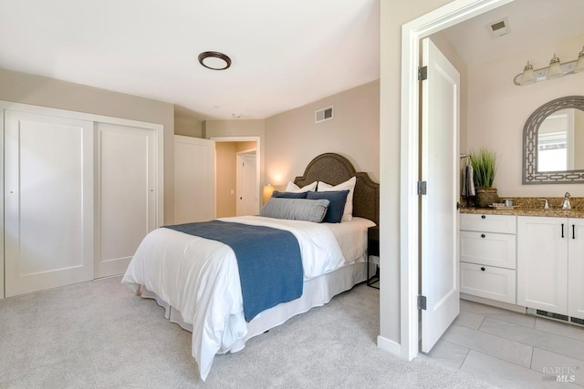 41 Salinas Ave, San Anselmo, CA 94960 - bedroom with light colored carpet, baseboards, a sink, and a closet