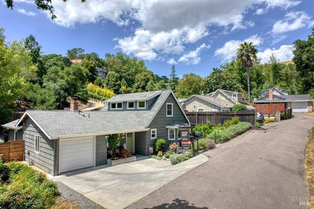 41 Salinas Ave, San Anselmo, CA 94960 - view of front of house with concrete driveway, an attached garage, roof with shingles, and view of scattered trees