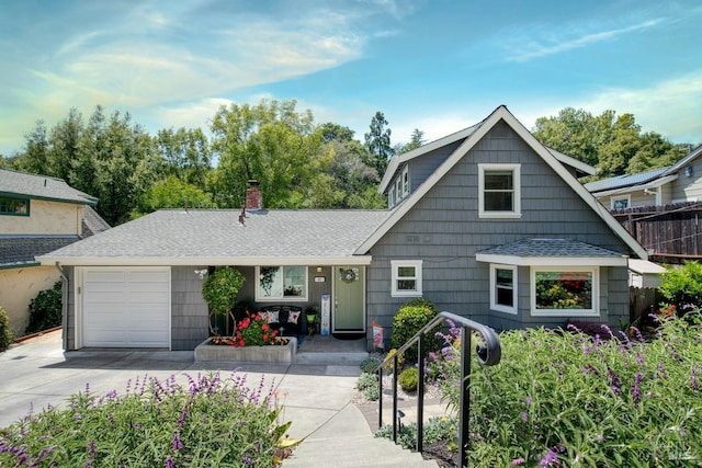 41 Salinas Ave, San Anselmo, CA 94960 - view of front of house with concrete driveway, an attached garage, roof with shingles, and a chimney
