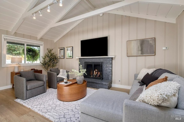 41 Salinas Ave, San Anselmo, CA 94960 - living area featuring wood finished floors, a fireplace, baseboards, and track lighting