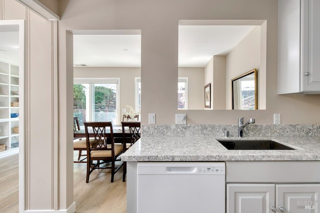 41 Salinas Ave, San Anselmo, CA 94960 - kitchen featuring white dishwasher, a sink, light wood-style flooring, white cabinets, and light stone countertops