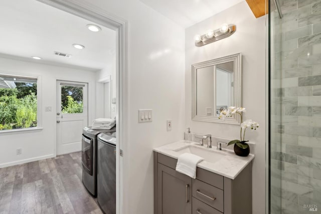 2120 Palmer Dr, Saint Helena, CA 94574 - full bathroom with washing machine and clothes dryer, vanity, wood finished floors, tiled shower, and recessed lighting