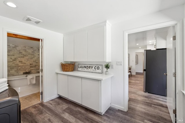 2120 Palmer Dr, Saint Helena, CA 94574 - kitchen with freestanding refrigerator, white cabinets, light countertops, and dark wood finished floors