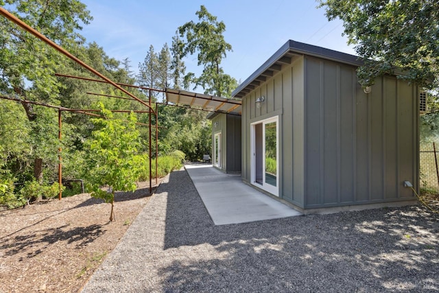 2120 Palmer Dr, Saint Helena, CA 94574 - back of property with board and batten siding and a patio