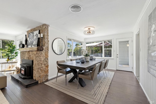 2120 Palmer Dr, Saint Helena, CA 94574 - dining space with crown molding, a wood stove, plenty of natural light, wood finished floors, and baseboards