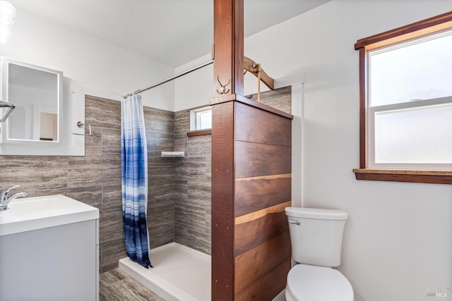 24 S University St, Healdsburg, CA 95448 - bathroom with tile walls, toilet, a shower stall, and vanity